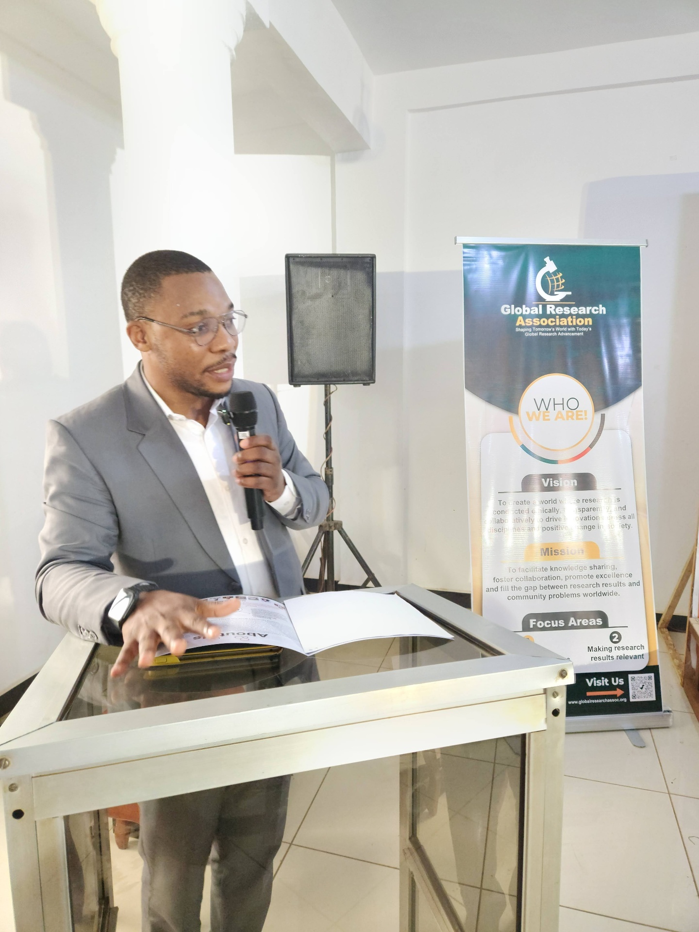 Speaker addressing delegates at the GRA Inaugural Colloquium podium