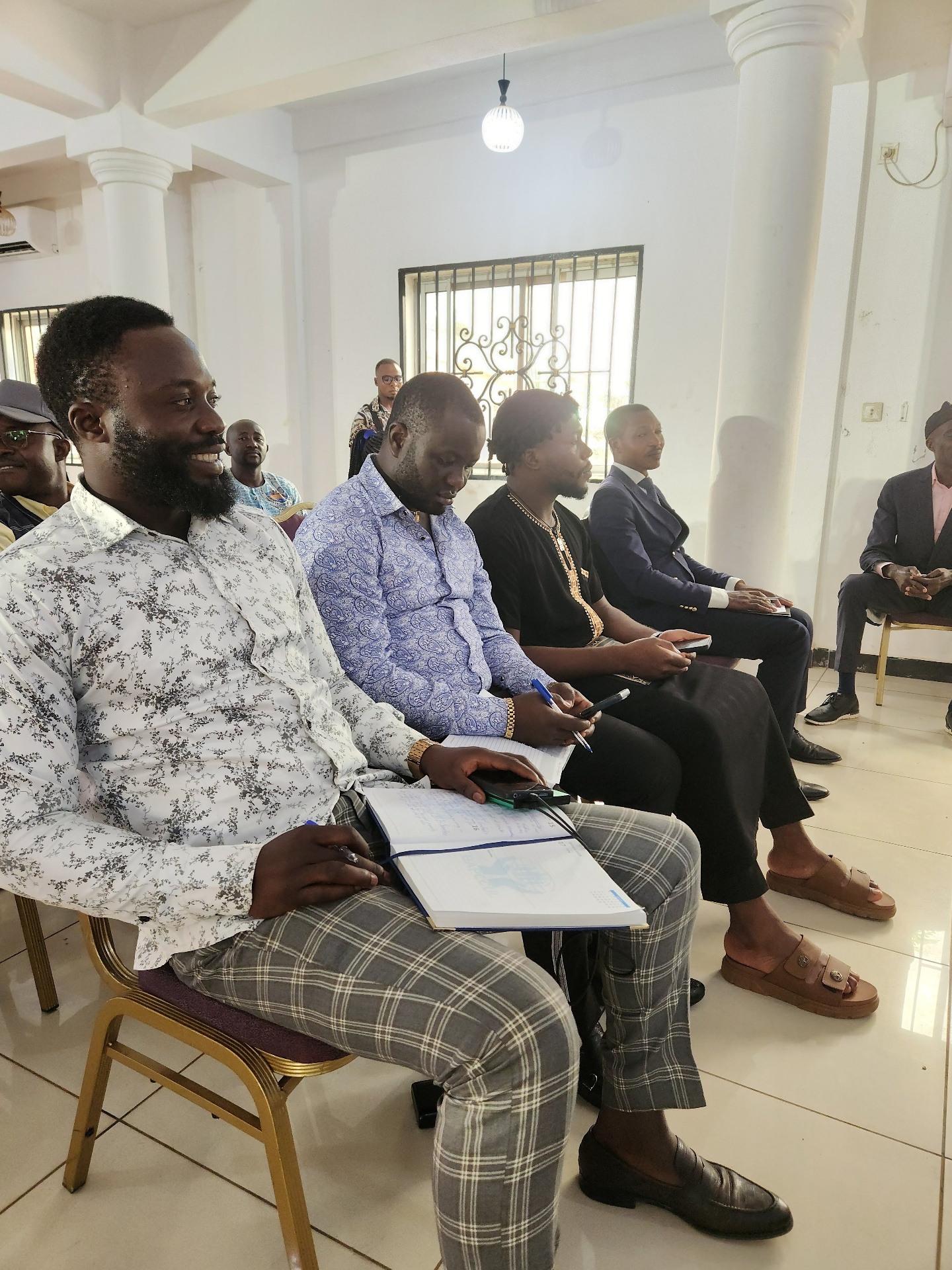 Delegates seated and taking notes during a session at the GRA Inaugural Colloquium